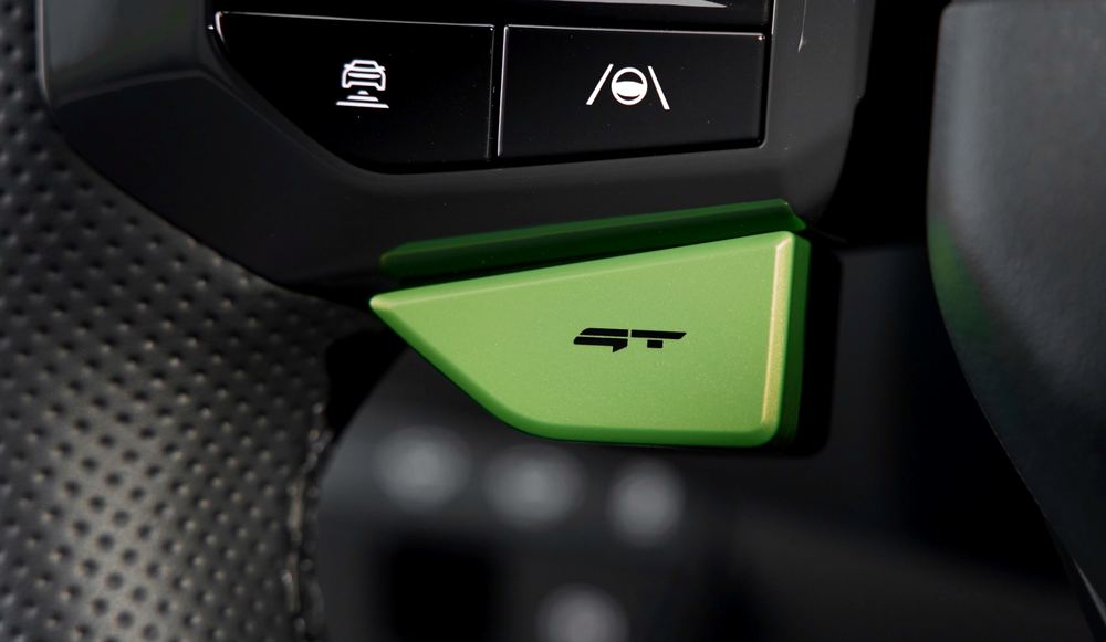 Groene GT Drive Mode-knop op het stuur